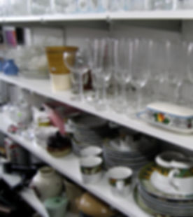 thrift shop glassware plates mugs bowls.
